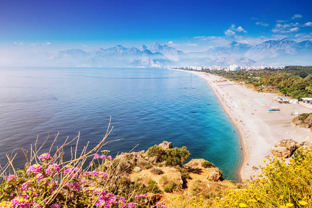 Famous Konyaalti beach, scenic panoramic view from a cliif top. Travel destinations of Turkey and Antalya and mediterranean riviera stock photo