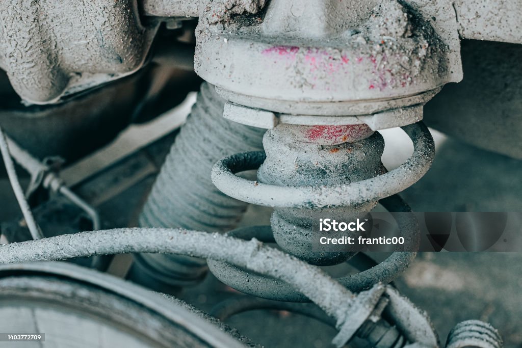 Old rusty and dirty shock spring and strut in the car Striding Stock Photo