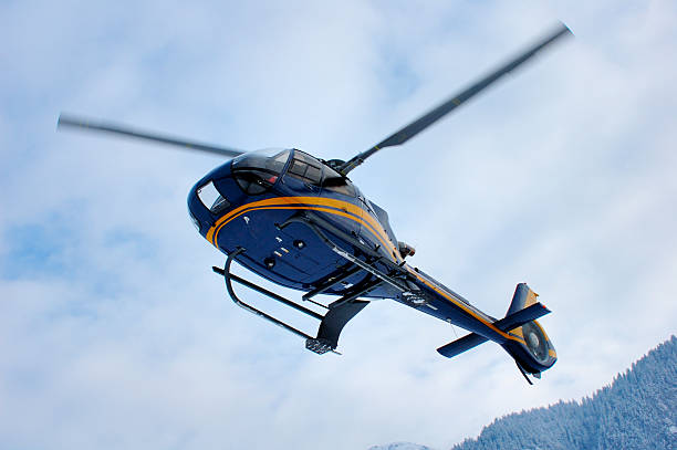 istock A mountain rescue helicopter flying against a cloudy sky 140377274