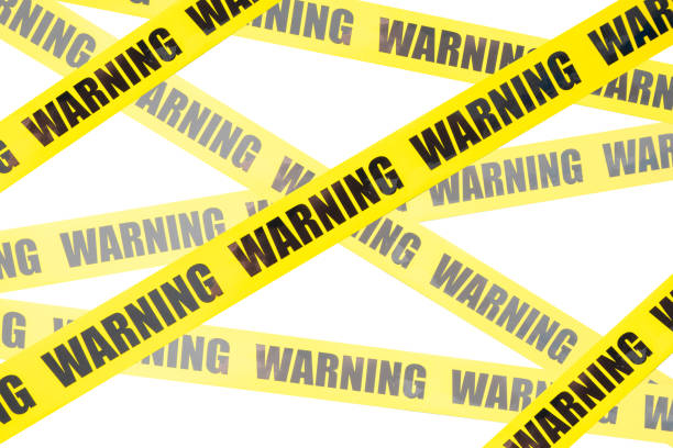 istock Yellow warning tape isolated and cutout on white background. Risk and accident concept 1403772744