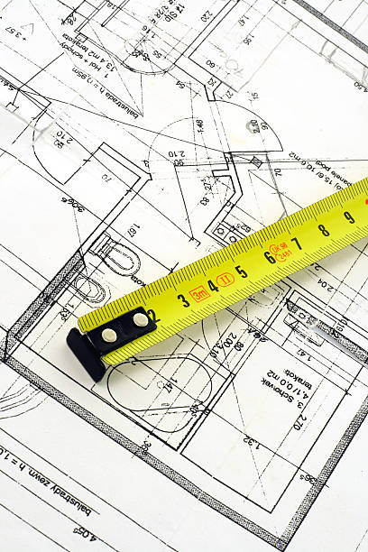 istock Top view of a tape measure on blueprint 140377308
