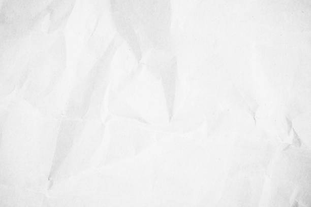 istock White recycled craft paper texture background. Abstract gray material old vintage page crumpled for grunge vignette of newspaper sheet. Pattern surface rough parchment crease with copy space for text. 1403776237