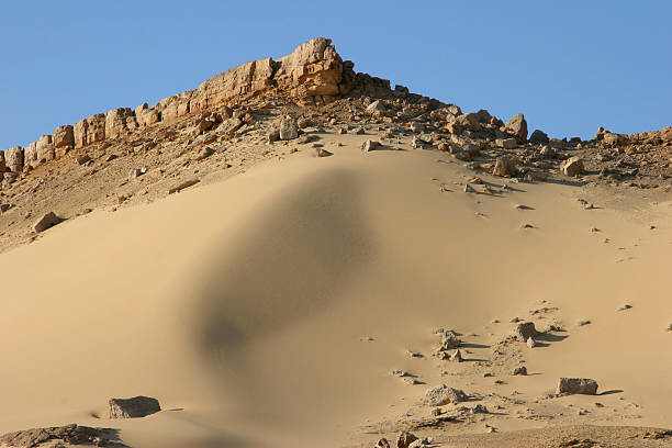 dented sand dune in western sahara of egypt stock photo