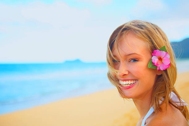 istock Beautiful young woman on the beach 140377741