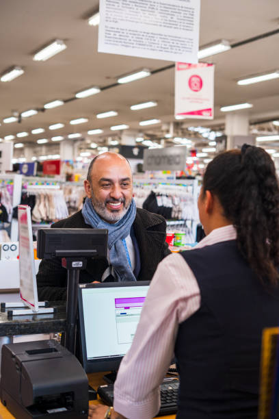 istock Man is paying for his things in front of the counter 1403778536
