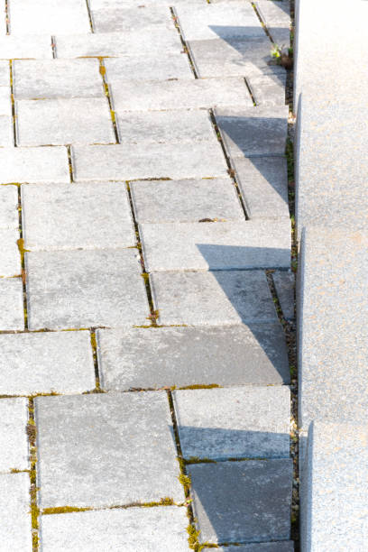 istock modern concrete pavers in a gray mix with granite edging 1403779772