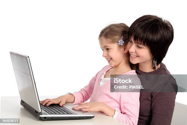 Mother And Daughter Using Laptop Stock Photo - Download Image Now - Adult, Beautiful People, Beauty