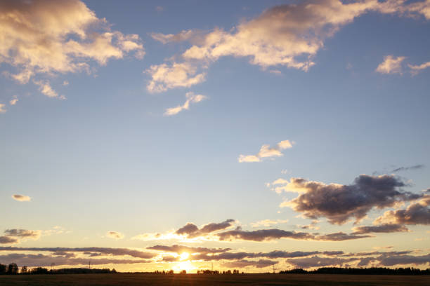 morning sky with clouds skyline with sun and field. morning in nature