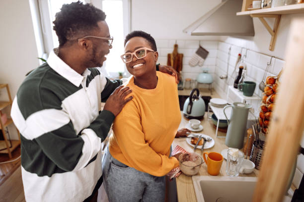 istock Young couple bonding in the kitchen 1403789690