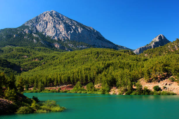 Spectacular Doyran lake in Konyaalti district of Antalya, Turkey. Lake shore is a popular place for outdoor camping and hiking just outside of Antalya. stock photo