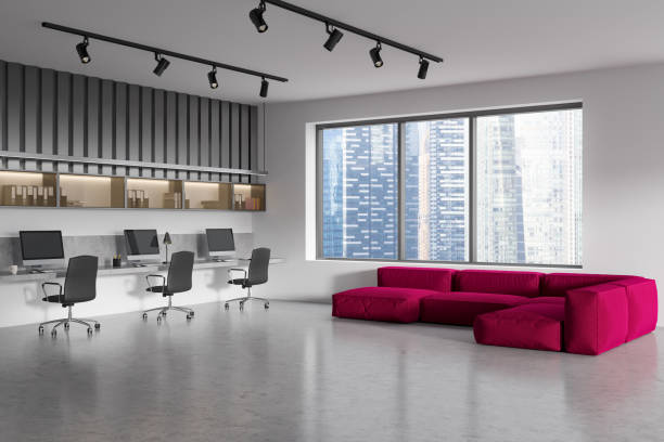 istock Office interior with couch and armchair with computer, window on city view 1403792361