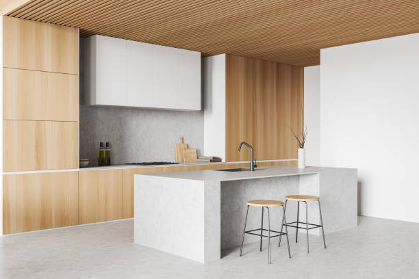 istock Corner view on bright kitchen room interior with island, cupboard 1403793011