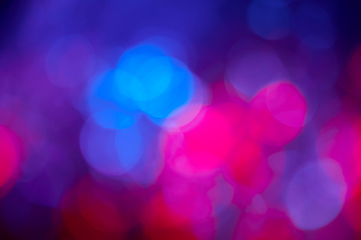Abstract red and blue defocused lights on black background