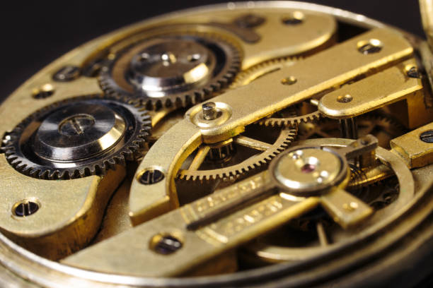 istock Old mechanical pocket watch. Clockwork gears wheels, close-up view. 1403793418
