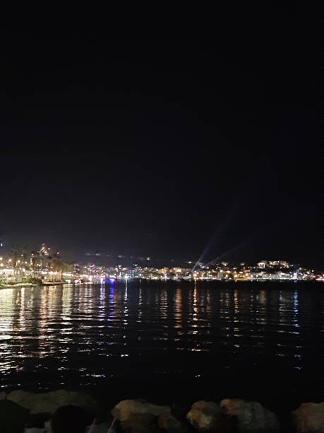 istock night city lights and sea view 1403794538
