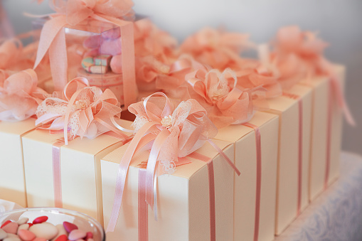 Pink gift box with yellow ribbon on white. This file is cleaned, retouched and contains clipping path.