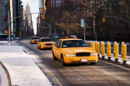 New York winter street scene with 3 taxis in a row 
