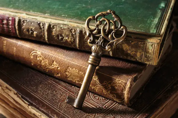 Antique key with ancient books
