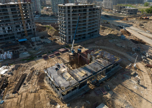istock Construction site, aerial view. Monolithic slab foundation and concrete pouring. Mobile auto Crane on formworks. 1403795637