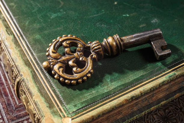 istock Antique bronze key with patina on ancient books 1403795713