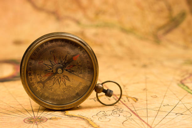 istock Old compass on vintage map. Adventure retro style. 1403797138