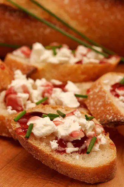 tasty appetizer of cheese and chives on sliced bread