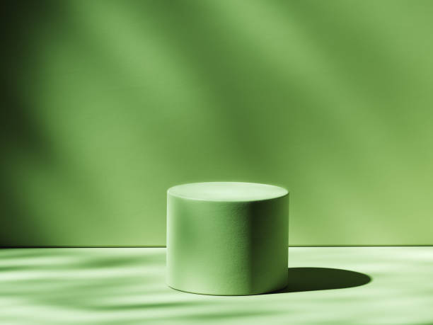 istock Green cylindrical pedestal illuminated from side. 3d computer graphic template of displaying place for your products. 1403800430