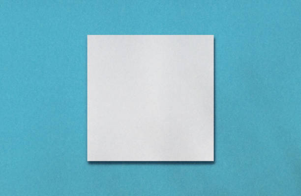 istock Blank white square or frame for your content on turquoise paper texture. Vivid colour background for your objects. Plain graphics element for further fashion work. 1403800634