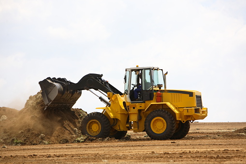 Front end loader clearing a construction site