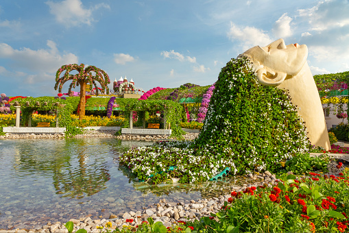 Dubai, United Arab Emirates - May 30, 2022: Female head decorated with flowers in Miracle garden of Dubai.