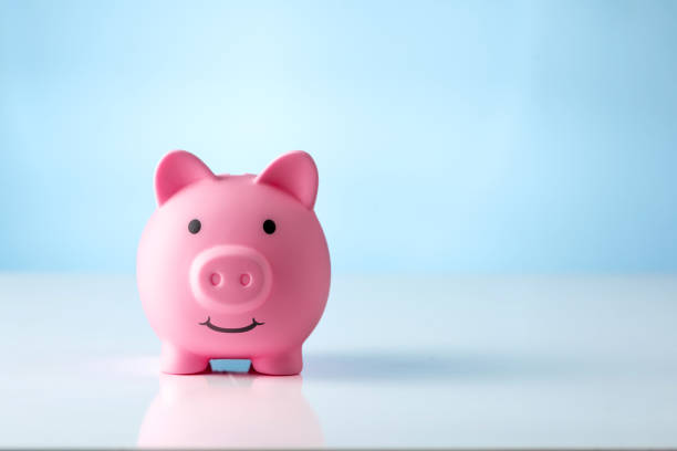 istock Piggy bank on blue background 1403803011