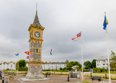 View of Queen Victorias Jubilee clock tower along the Esplanade promenade with hotels and guesthouses to the rear, Weymouth, Dorset, England, UK, Western Europe.