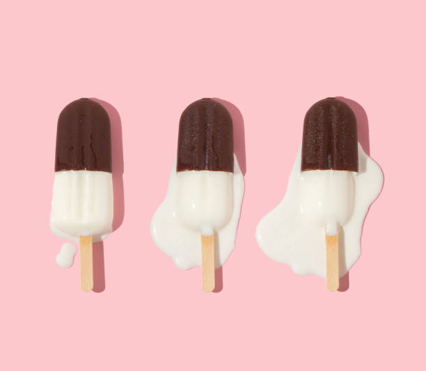 istock Summer creative pattern with ice cream popsicle melting on pastel pink background.  70s, 80s or 90s retro aesthetic fashion idea. Minimal summer idea. 1403804995
