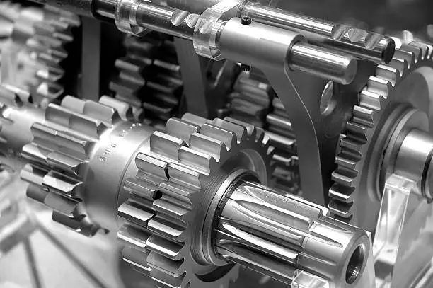 Partial view of gears in a machine in black and white