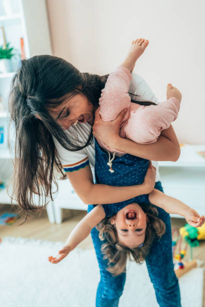 Mother and toddler having fun stock photo