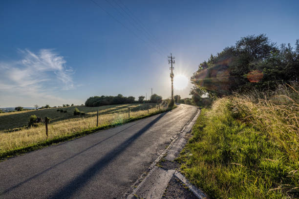 A country road in rural Pennsylvania with hills in the background.
