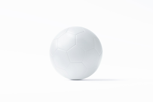 White soccer ball sitting on white background. Horizontal composition with copy space. Clipping path is included.