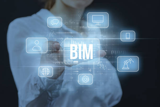 Concept BIM or Building Information Modeling. Business acronym. The person is holding a gadget with a holographic display. stock photo