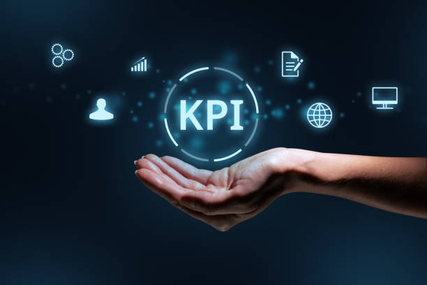 istock Concept KPI or Key Performance Indicator. Business acronym. Holographic text and icons over hand 1403814183