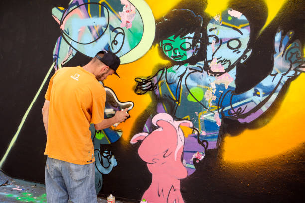 Sao Paulo, Brazil, Janeiro 27, 2007. Man makes a graffiti in the wall on Paulista Avenue tunnel, for the celebrations of Japanese Immigration to Brazil