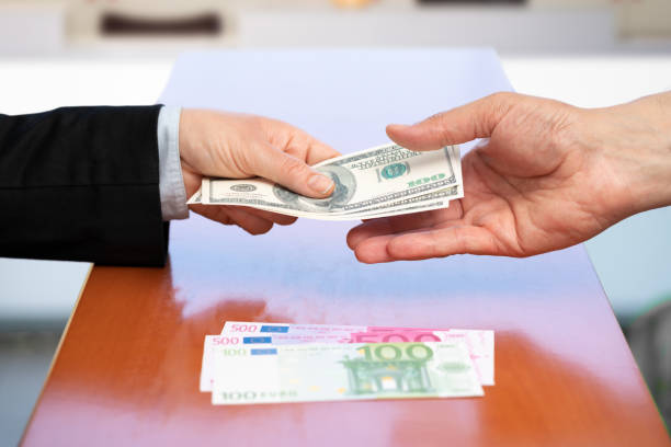 istock stewardess returning money changing at the airport 1403814265