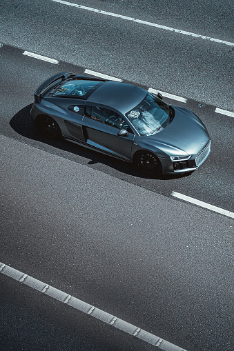 M1 Motorway, United Kingdom - May 18, 2022: Audi R8 grey driving on the M1 Motorway