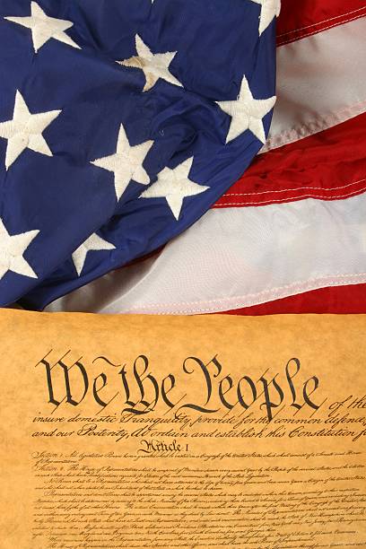 istock American Flag and US Constitution -- Vertical 140381686