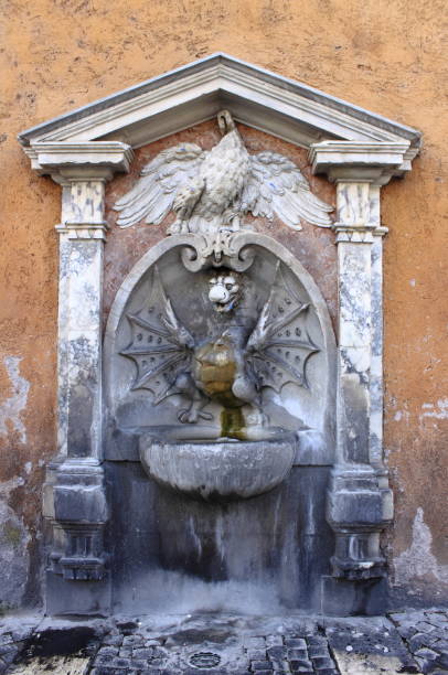 istock Fountain of the dragon statue in Rome 1403817419
