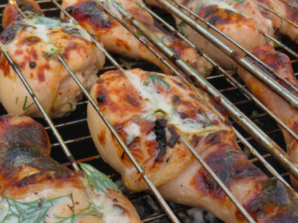 istock Grilled chicken meat fried on coals 1403819151
