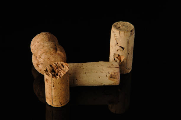 istock Close-up shot of some wine corks on a reflecting surface. 1403819338