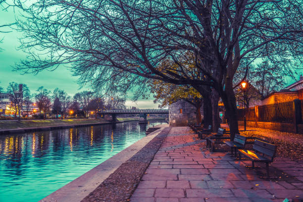 Lendal Bridge at sunset. The bridge is relected in the River Ouse