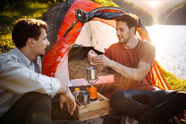 istock Two campers preparing lunch on a camping trip 1403821566