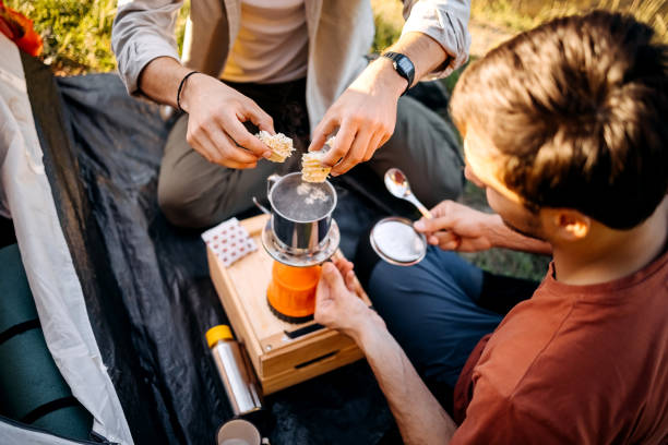 istock Two campers preparing lunch on a camping trip 1403821650