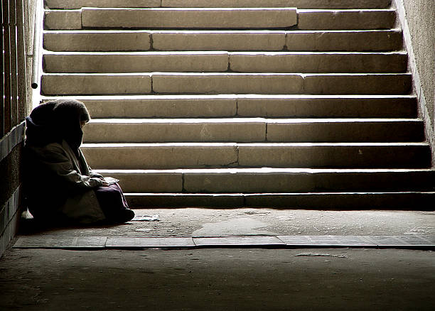 Read photo of beggar woman reading the book in undergrund subway Begging stock pictures, royalty-free photos & images